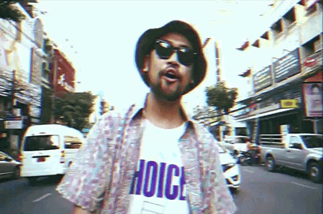 a man wearing sunglasses and a shirt that says choice