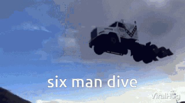 a truck is flying through the air with the words six man dive written on the bottom