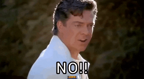 a man in a white shirt is saying no