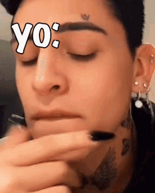 a close up of a person 's face with the word yo written on it
