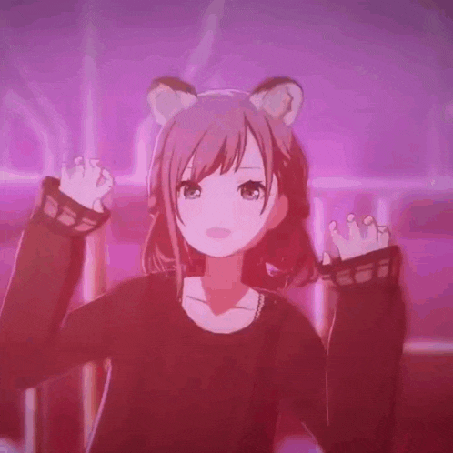 a girl with a cat ear on her head is wearing a black sweater and dancing .