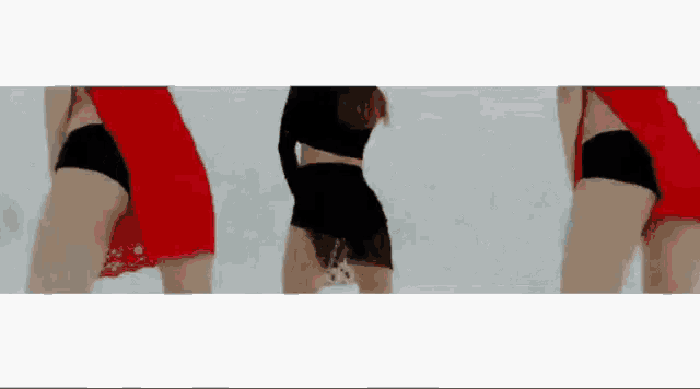a woman in a red dress and black shorts is dancing on a white surface .