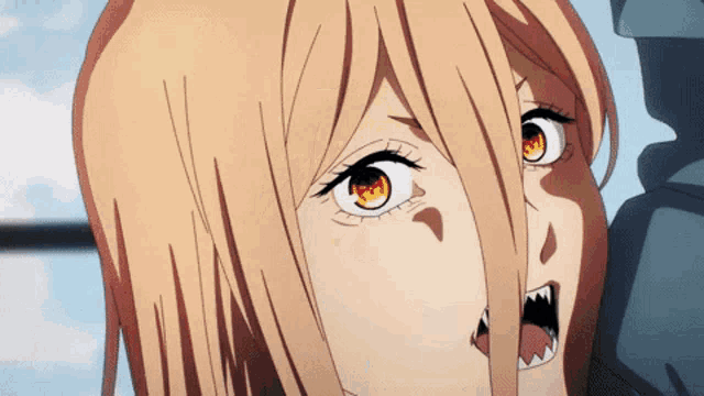 a close up of a person 's face with a cartoon character 's mouth open