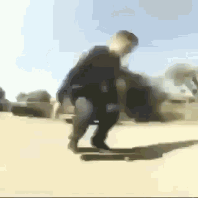 a blurry picture of a person riding a skateboard down a street