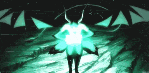 a person with horns and wings is standing in the dark with a green light behind them .