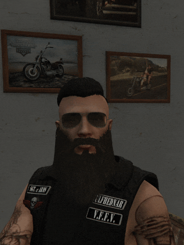 a man with a beard is wearing sunglasses and a vest that says ulfhednar