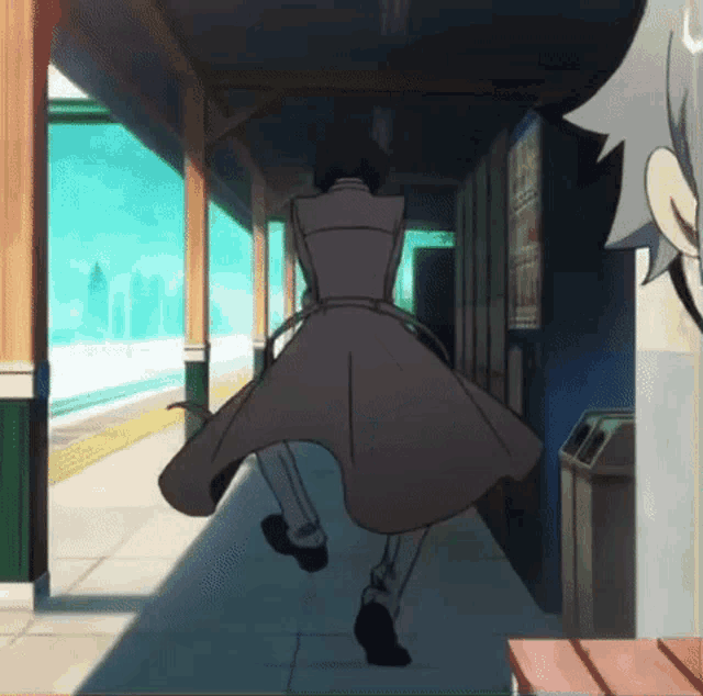 a person in a trench coat is running down a hallway