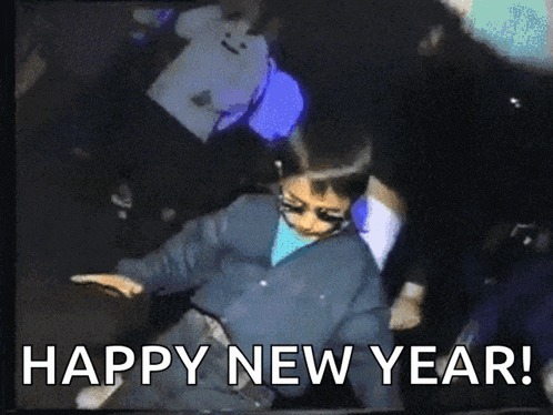 a picture of a person dancing with the words happy new year below them