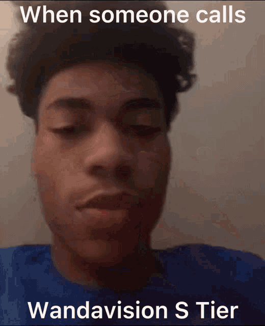 a young man in a blue shirt with a caption that reads when someone calls wandavision s tier