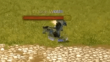 a screenshot of a video game with a prairie wolf standing in the grass .