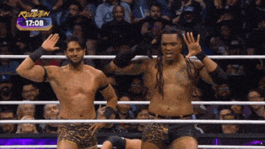 two men in a wrestling ring with the time of 7:08 on the screen