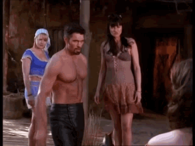 a group of people are standing next to each other in a room .