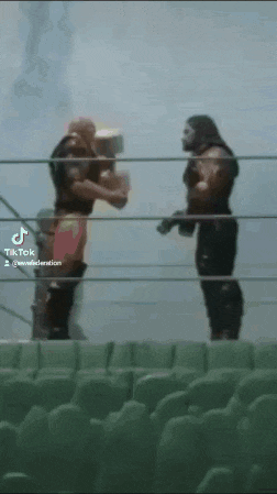 two wrestlers standing in a ring with a tiktok watermark on the bottom