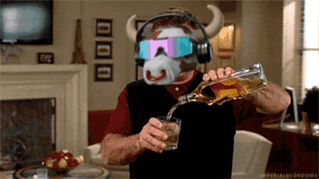 a man wearing a cow mask and headphones pours a glass of whiskey