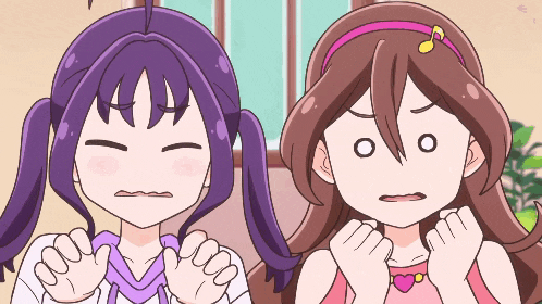 two cartoon girls with purple hair and brown hair are making funny faces