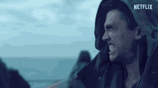a man in a hooded jacket with a netflix logo on the bottom