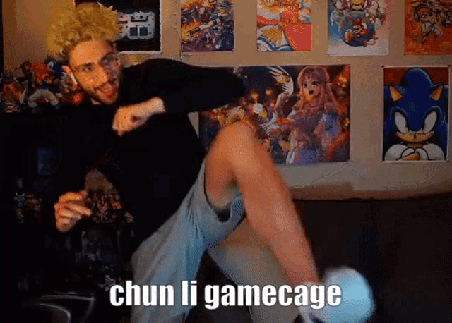 a man is kicking a stuffed animal with the words chun li gamecage behind him