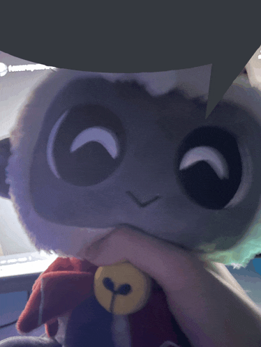 a person is holding a stuffed animal with a speech bubble behind it