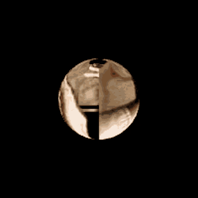 a close up of a cartoon eye with a black background