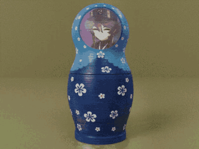 three russian nesting dolls with flowers on them