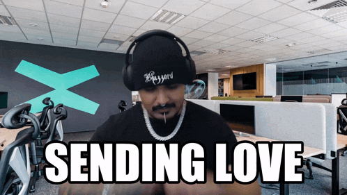 a man wearing headphones and a beanie with the word bizzard on it