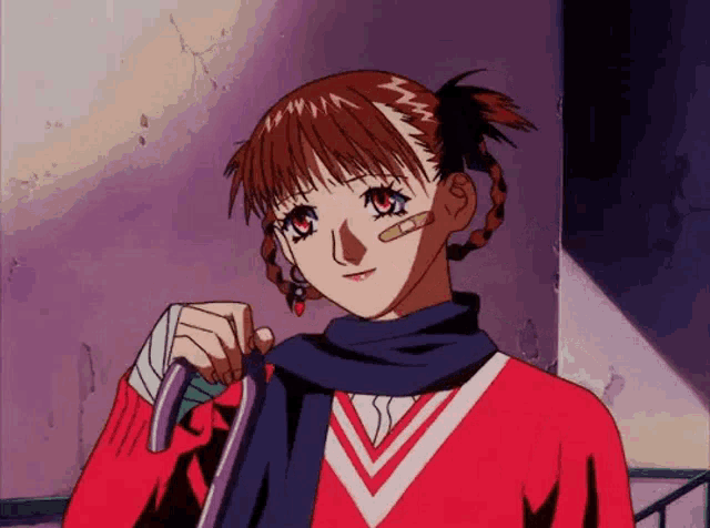 a girl with a bandage on her forehead is wearing a red sweater and scarf