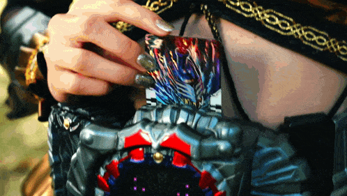 a close up of a person 's hand holding a card
