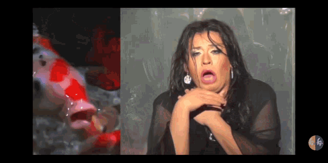 a woman is making a funny face in front of a fish