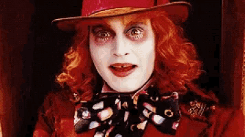a close up of a person dressed as the mad hatter from alice in wonderland .