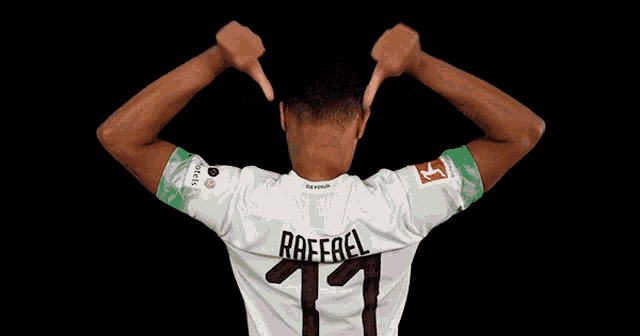 a man wearing a white jersey with the name rafael on it