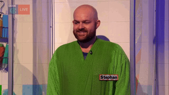 a man wearing a green robe with the name stephan on his chest