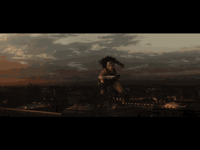 a woman in a wonder woman costume is flying through the air