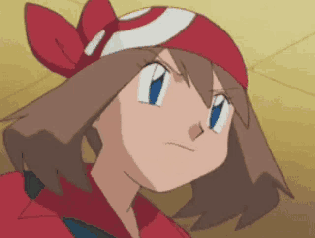 a close up of a cartoon character with a red headband on