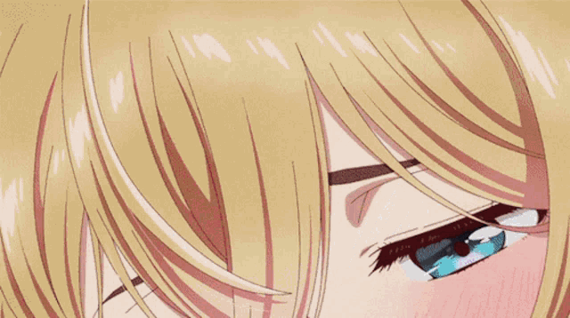 a close up of a girl with blue eyes