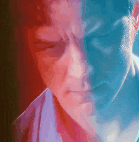 a close up of a man 's face with red and blue highlights