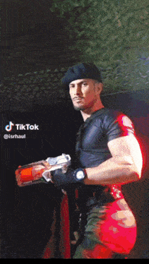 a man wearing a cowboy hat and a blue shirt has a tiktok sticker on his phone