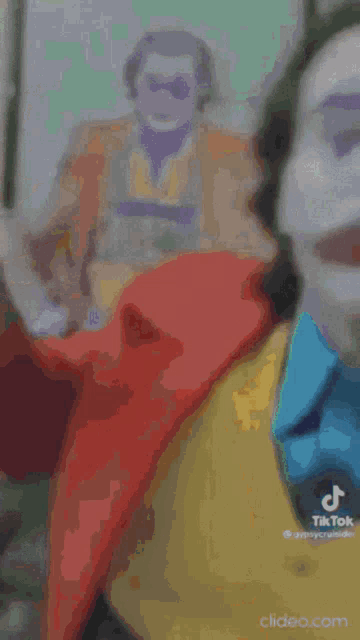 a blurry picture of a person dressed as the joker .