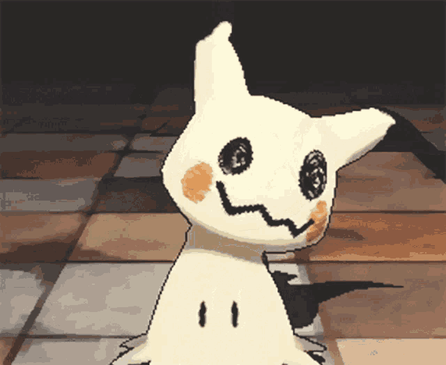 a pixel art drawing of a white cat with black eyes and a black tail