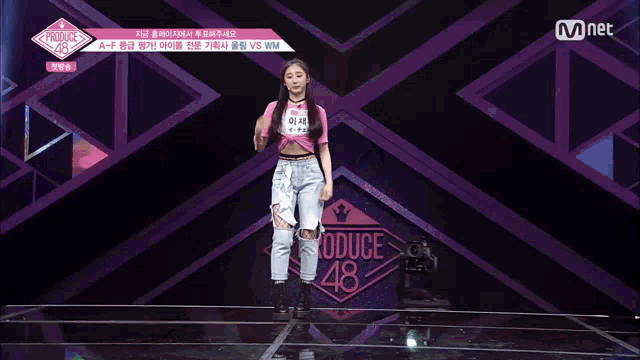 a girl with a name tag that says produce 48
