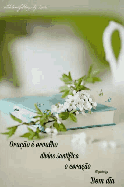 a book with flowers on top of it and a quote in spanish
