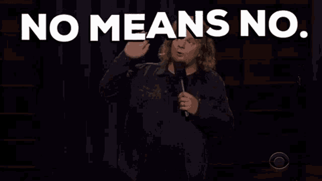 a man is giving a speech with the words no means no