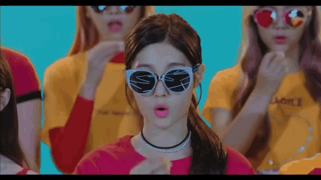 a girl wearing sunglasses and a choker has a pink lip