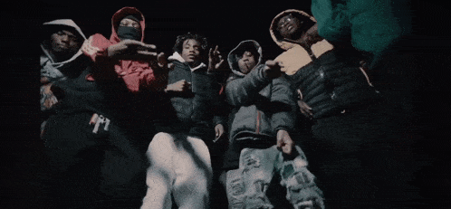 a blurry picture of a group of people in a dark room .