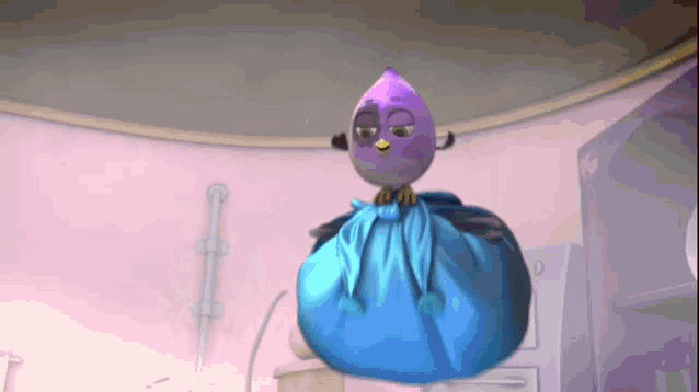 a purple bird is sitting on a blue bag in a room
