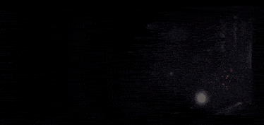 a dark background with a lot of glowing lights