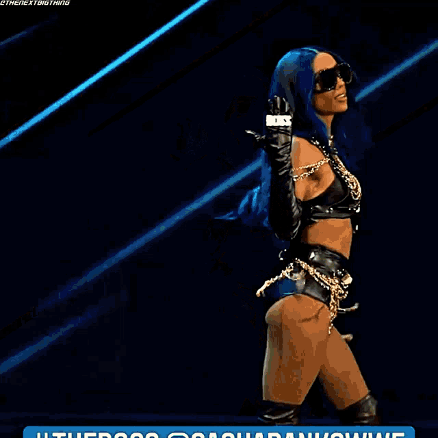 a woman with blue hair is wearing a black outfit