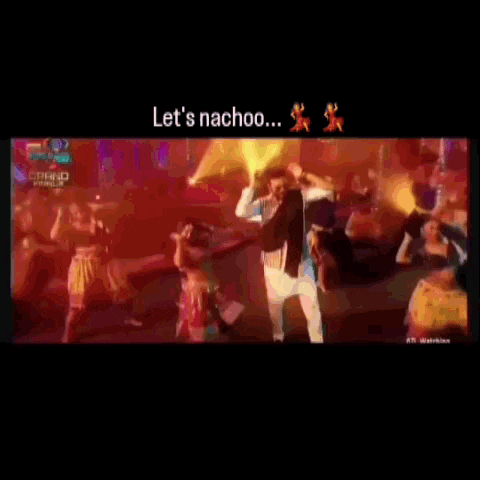 a group of people are dancing in front of a large fire and the words let 's nachoo