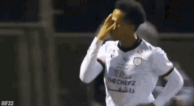 a soccer player wearing a shirt that says rebel the chefz