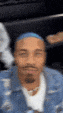 a blurry picture of a man with a blue headband