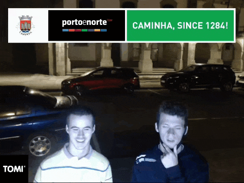 two men are standing in front of a sign that says porto norte